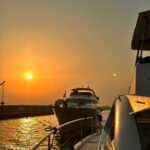 Sunset boats returning to Marinia